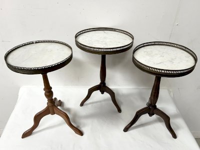 A set of three Louis XVI style side tables made of wood and marble, 20th century.