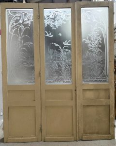 Set of three Art Nouveau wooden and etched glass separating doors, 20th century.