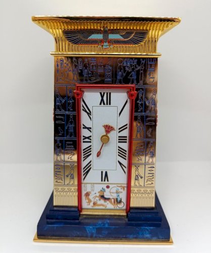 Superbe horloge la pendule du pharaon en cuivre massif rehausse dor 24carats en bon etat (made in chiner)