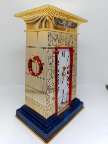 superbe horloge la pendule du pharaon en cuivre massif rehausse dor 24carats