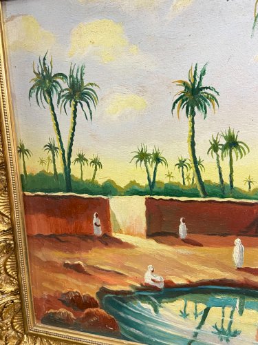 Tableau orientaliste représentant une vue animée d'une oasis palmiers Sud Maroc
