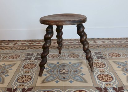 Antique tripod stool made of turned wood