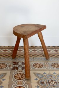 Antique wooden tripod stool – rustic half-moon seat