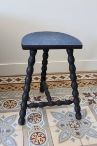 Antique tripod stool made of turned wood, painted black – Half-moon seat