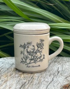 Stoneware tea cup with botanical patterns