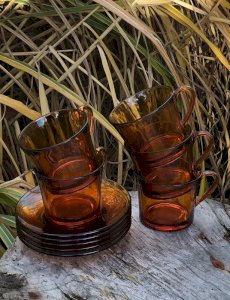 Vintage retro Duralex amber glass coffee cups and saucers.