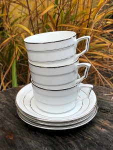 White and silver porcelain cups and saucers.