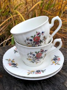 Vintage retro porcelain cups and saucers by Sofafils with floral patterns
