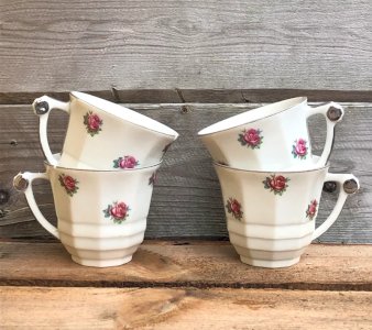 Vintage retro porcelain cups with small flower patterns