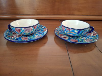 Two coffee cups and saucers set in Longwy enamels.