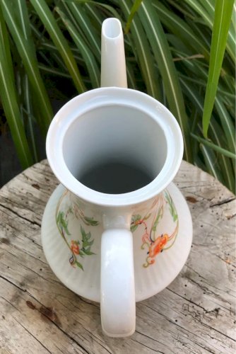 Théière vintage en porcelaine de Chauvigny motifs fleurs oranges