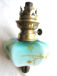 Piano top, oil lamp, opaline glass decorated with gilded leaves.