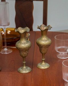 Ulysses, the pair of brass candlesticks N°24