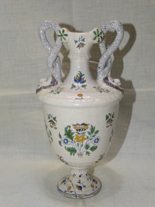 - CERAMIC VASE MOUSTIERS WITH ROLLED HANDLES and MASKS at the BASE FOOT DAMAGED D