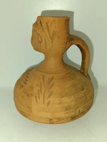 vase dans le gout des productions gallo romain anthropomorphe en bon etat