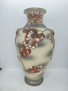 Japanese ceramic vase with floral decoration, signed under the base, in good condition.