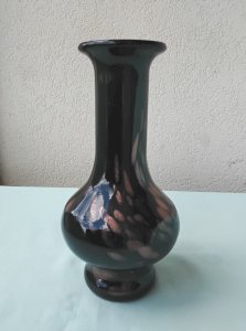 Black glass vase with golden glitter.