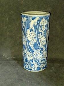 Chinese porcelain rolled vase with floral decor in good condition.