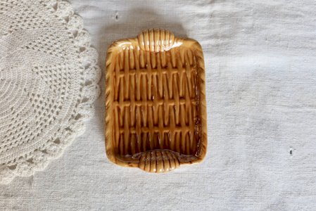 Vintage ceramic catchall in mustard color with a woven effect