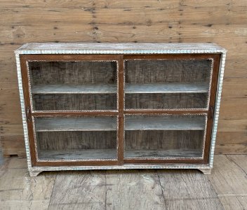 Burmese teak display cabinet with sliding doors.