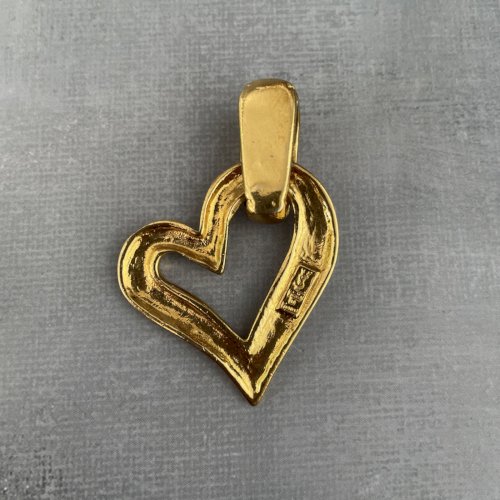 YSL Yves Saint Laurent pendentif coeur doré bijou de luxe vintage intemporel